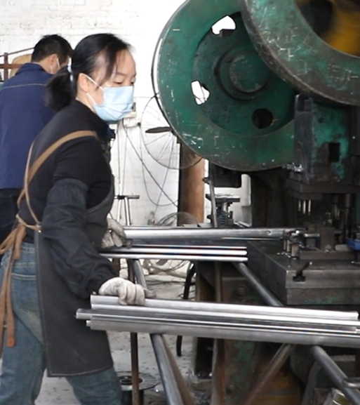 Workshop view showing furniture manufacturing and quality control process.
